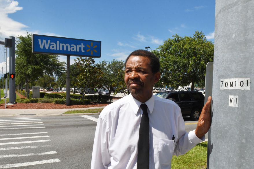 Standing near the Cocoa Walmart. Pastor Tommy Studstill, whose ministry is called Greater Love For the Homeless, feels that the Walmart stores that he has dealt with are very understanding of the homeless. (Tim Shortt/Florida Today via AP)