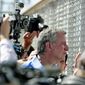 New York City Mayor Bill de Blasio looks through a closed gate at the Port of Entry facility, Thursday, June 21, 2018, in Fabens, Texas, where tent shelters are being used to house separated family members. Mayors from more than a dozen U.S. cities including New York and Los Angeles gathered near the holding facility for immigrant children on Texas&#39; border with Mexico to call for the immediate reunification of immigrant children with their families. (AP Photo/Matt York)