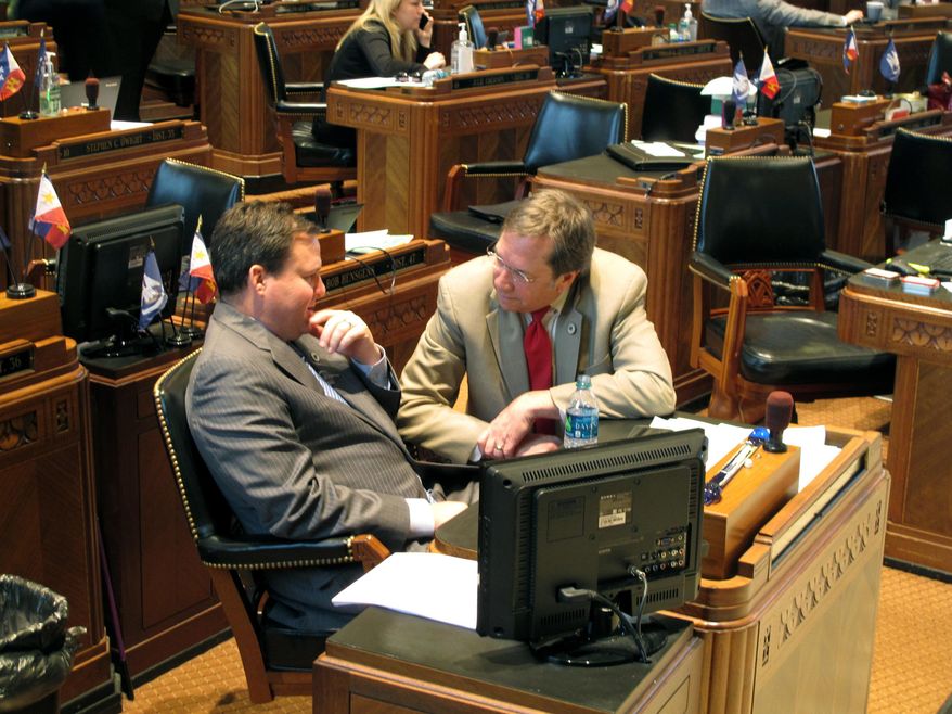 Rep. Stuart Bishop, R-Lafayette, left, speaks with Rep. Rob Shadoin, R-Ruston, after Bishop pulled his sales tax bill from House consideration on Thursday, June 21, 2018, in Baton Rouge, La. (AP Photo/Melinda Deslatte)