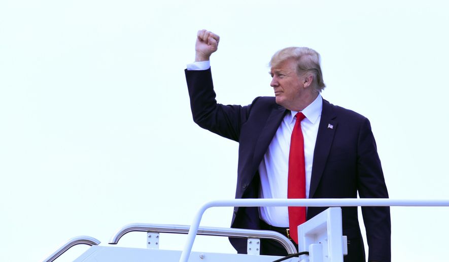 President Donald Trump walks up the steps of Air Force One at Andrews Air Force Base in Md., Wednesday, June 20, 2018. Trump is heading to Duluth, Minn., to speak at a rally for Pete Stauber, a Republican congressional candidate running in a traditionally Democratic district. (AP Photo/Susan Walsh)