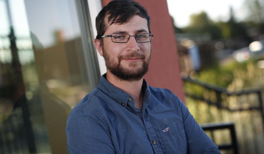 Alex Leith, a former Democrat who switched to unaffiliated two years ago, poses for a picture, Thursday, June 21, 2018, in Denver. For the first time, Colorado is allowing unaffiliated voters, the state's largest voting bloc, to participate in the major party midterm primaries, thanks to a voter-passed initiative that largely was spurred by disenchantment with the polarization of the 2016 presidential election and candidates many voters viewed as unresponsive to their concerns. (AP Photo/David Zalubowski)