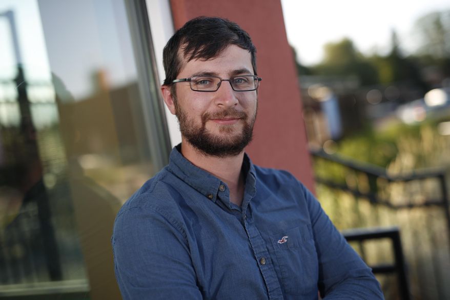 Alex Leith, a former Democrat who switched to unaffiliated two years ago, poses for a picture, Thursday, June 21, 2018, in Denver. For the first time, Colorado is allowing unaffiliated voters, the state's largest voting bloc, to participate in the major party midterm primaries, thanks to a voter-passed initiative that largely was spurred by disenchantment with the polarization of the 2016 presidential election and candidates many voters viewed as unresponsive to their concerns. (AP Photo/David Zalubowski)