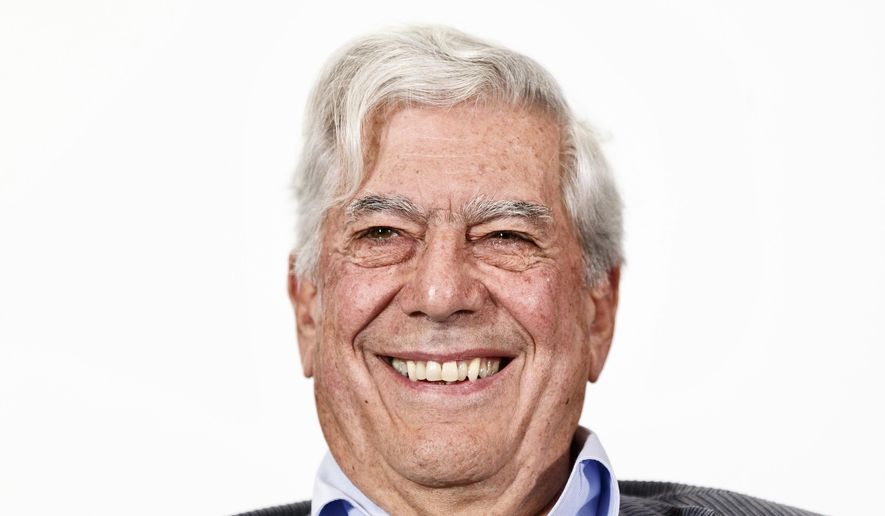 FILE - In this April 24, 2013 file photo, Peruvian writer and Nobel Prize winner in literature Mario Vargas Llosa smiles during a press conference at the presentation of a new theater play in Madrid, Spain. Vargas Llosa is under observation, Thursday, June 21, 2018, at a Madrid hospital after sustaining light injuries in a fall at home. (AP Photo/Daniel Ochoa de Olza, File)