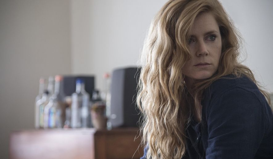 This image released by HBO shows Amy Adams in a scene from the series "Sharp Objects," premiering July 8 on HBO. (Anne Marie Fox/HBO via AP)
