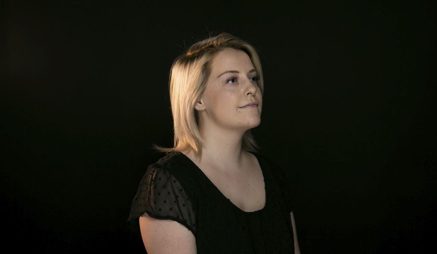 In this Friday, June 15, 2018, photo, Kori Haubrich, 23, poses for a portrait at the studio of the newspaper in Yakima, Wash. When Haubrich was in her late teens, she was diagnosed with depression, anxiety and obsessive-compulsive disorder. She began taking medication but stopped after two years, believing she no longer needed it. About a month later, she attempted to kill herself. Two years after her attempt, Haubrich calls herself a survivor. (Amanda Ray/Yakima Herald-Republic via AP)