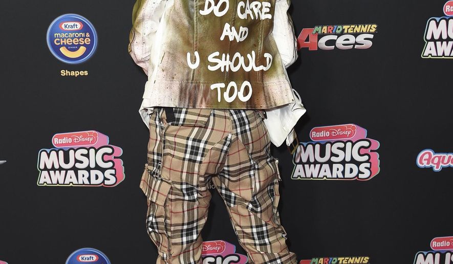 FILE - In this June 22, 2018 file photo, Jenna Ortega attends the 2018 Radio Disney Music Awards at Loews Hotel in Los Angeles. Ortega wore a green, hooded military jacket reading “I do care and u should too” on the red carpet at the Radio Disney Music Awards Friday night, to counter the “I really don't care, do u?" jacket the first lady wore as she left to visit detained migrant children this week.(Photo by Richard Shotwell/Invision/AP, File)