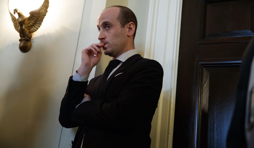 Senior White House adviser Stephen Miller listens as President Donald Trump speaks during a meeting with lawmakers on immigration policy in the Cabinet Room of the White House, Tuesday, Jan. 9, 2018, in Washington. (AP Photo/Evan Vucci)