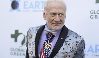FILE - In this Feb. 28, 2018, file photo, Buzz Aldrin attends the 15th annual Global Green Pre-Oscar Gala, at NeueHouse Hollywood in Los Angeles. Aldrin is suing two of his children and a business manager, accusing them of misusing his credit cards, transferring money from an account and slandering him by saying he has dementia. (Photo by Richard Shotwell/Invision/AP, File)