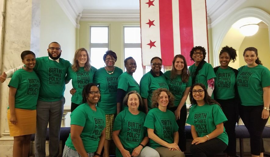 Members of the &quot;Birth to Three Policy Alliance&quot; waited in matching shirts outside the D.C. Council chambers Tuesday and cheered when they heard that the council unanimously approved legislation funding early childhood education iniatitives they had supported for the 10 years. (Julia Airey/ The Washington Times)