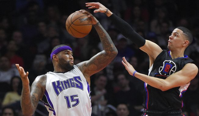 Sacramento Kings center DeMarcus Cousins, left, grabs a rebound away from Los Angeles Clippers guard Austin Rivers during the first half of an NBA basketball game, Saturday, Jan. 16, 2016, in Los Angeles. (AP Photo/Mark J. Terrill) ** FILE **

