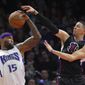Sacramento Kings center DeMarcus Cousins, left, grabs a rebound away from Los Angeles Clippers guard Austin Rivers during the first half of an NBA basketball game, Saturday, Jan. 16, 2016, in Los Angeles. (AP Photo/Mark J. Terrill) ** FILE **

