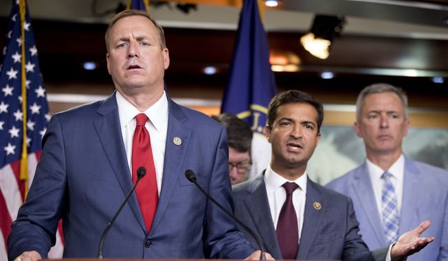 Rep. Jeff Denham, R-Calif., left, and Rep. Carlos Curbelo, R-Fla., second from left, accompanied by Rep. John Katko, R-N.Y., right, respond to a reporter&#x27;s question during a news conference on Capitol Hill in Washington, Wednesday, June 27, 2018, after the Republican-led House rejected a far-ranging immigration bill despite its eleventh-hour endorsement by President Donald Trump. The gulf between the GOP&#x27;s moderate and conservative wings proved too deep for leaders to avert an election-year display of division on the issue. (AP Photo/Andrew Harnik)
