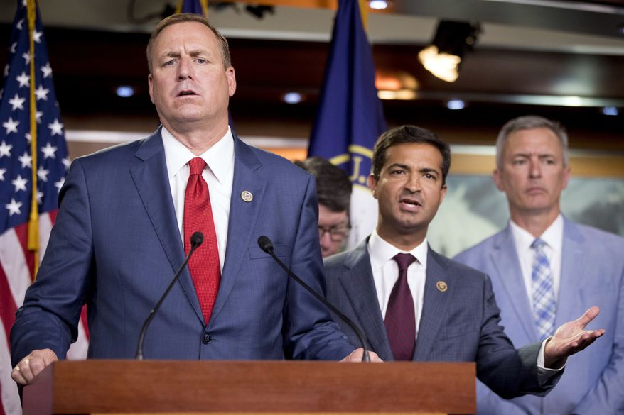 Rep. Jeff Denham, R-Calif., left, and Rep. Carlos Curbelo, R-Fla., second from left, accompanied by Rep. John Katko, R-N.Y., right, respond to a reporter's question during a news conference on Capitol Hill in Washington, Wednesday, June 27, 2018, after the Republican-led House rejected a far-ranging immigration bill despite its eleventh-hour endorsement by President Donald Trump. The gulf between the GOP's moderate and conservative wings proved too deep for leaders to avert an election-year display of division on the issue. (AP Photo/Andrew Harnik)