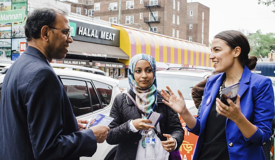 This May 6, 2018, file photo provided by the Alexandria Ocasio-Cortez Campaign shows candidate Alexandria Ocasio-Cortez, right, during a Bengali community outreach in New York. Ocasio-Cortez, a 28-year-old political novice running on a low budget and an unabashedly liberal platform, upset longtime U.S. Rep. Joseph Crowley on Tuesday in the Democratic congressional primary in New York. (Corey Torpie/Courtesy Alexandria Ocasio-Cortez Campaign via AP)