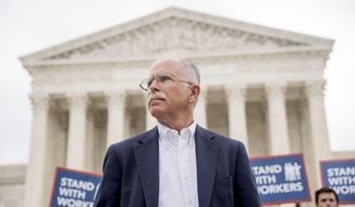 Plaintiff Mark Janus stands outside the Supreme Court after the court rules in a setback for organized labor that states can&#39;t force government workers to pay union fees, Wednesday, June 27, 2018, in Washington. (AP Photo/Andrew Harnik) **FILE**