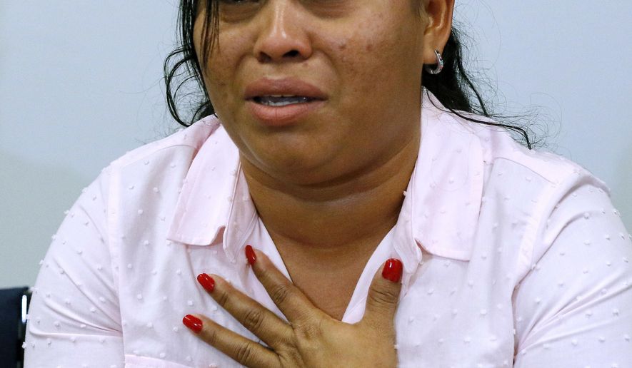 Angelica Rebeca Gonzalez-Garcia pleads to be reunited with her 8-year-old daughter during a news conference at the office of the American Civil Liberties Union of Massachusetts, Wednesday, June 27, 2018, in Boston. Gonzalez-Garcia, who is seeking asylum, is suing for the release of her daughter. She said the two were separated after illegally crossing the U.S.-Mexico border at Arizona in May. (AP Photo/Bill Sikes)