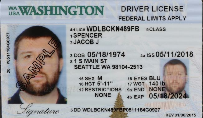 A sample copy of a Washington drivers license is shown at the Washington state Dept. of Licensing office in Lacey, Wash., Friday, June 22, 2018. Some Washington licenses and identification cards will soon be marked with the words &amp;quot;federal limits apply&amp;quot; as the state moves to comply with a federal law that increased rules for identification needed at airports and federal facilities. (AP Photo/Ted S. Warren)