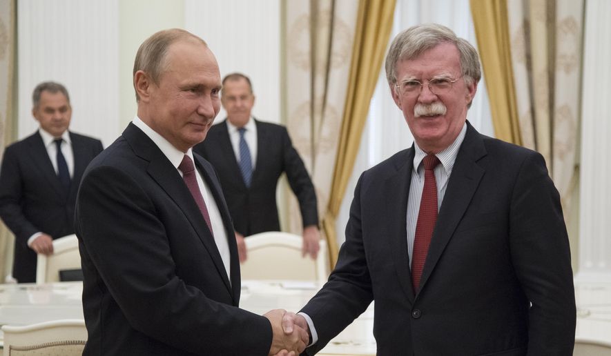 Russian President Vladimir Putin, left, shakes hands with U.S. National security adviser John Bolton during their meeting in the Kremlin in Moscow, Russia, Wednesday, June 27, 2018.  U.S. President Donald Trump&#39;s national security adviser is due in Moscow Wednesday to lay the groundwork for a possible U.S.-Russia summit. (AP Photo/Alexander Zemlianichenko, Pool)