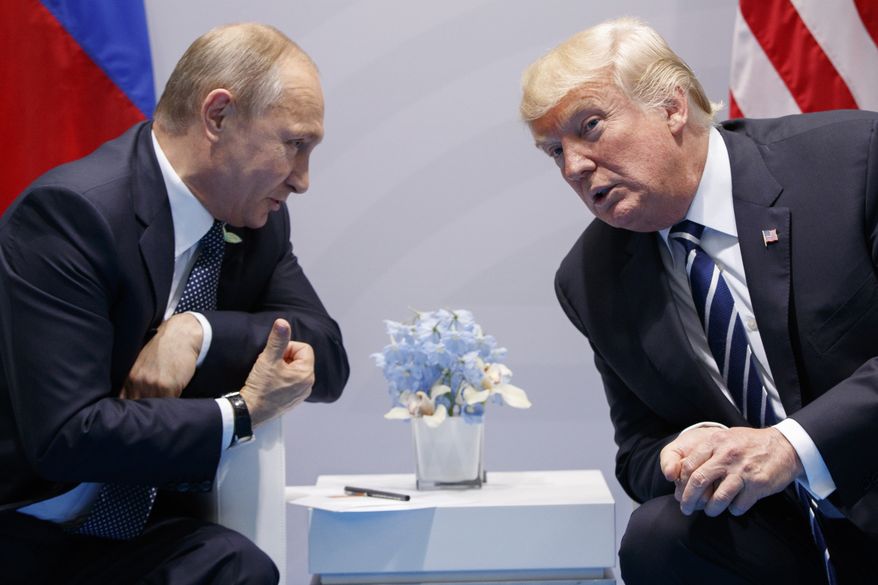 FILE - In this Friday, July 7, 2017, file photo U.S. President Donald Trump meets with Russian President Vladimir Putin at the G-20 Summit in Hamburg.  The Kremlin and the White House have announced Thursday June 28, 2018, that a summit between Russian President Vladimir Putin and U.S. President Donald Trump will take place in Helsinki, Finland, on July 16. (AP Photo/Evan Vucci, FILE)