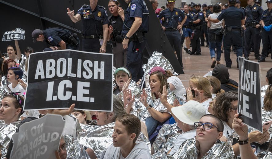 Hundreds of activists protest the Trump administration&#39;s approach to illegal border crossings and separation of children from immigrant parents, in the Hart Senate Office Building on Capitol Hill in Washington, Thursday, June 28, 2018. (AP Photo/J. Scott Applewhite)