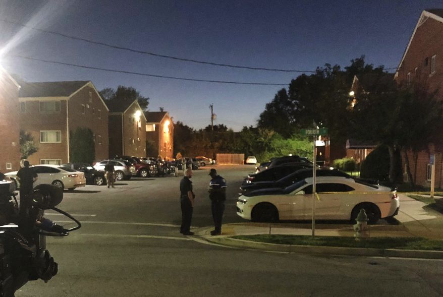 Police block off the area around the home of a suspect who opened fire on a newspaper office in Maryland&#39;s capital earlier, in Laurel, Md., Thursday, June 28, 2018. A man armed with smoke grenades and a shotgun attacked journalists at a newspaper in Maryland&#39;s capital Thursday, killing several people before police quickly stormed the building and arrested him, police and witnesses said. A law enforcement official said the suspect has been identified as Jarrod W. Ramos. (AP Photo/Michael Kunzelman)