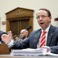 Deputy Attorney General Rod Rosenstein, right, accompanied by FBI Director Christopher Wray, left, testifies before a House Judiciary Committee hearing on Capitol Hill in Washington, Thursday, June 28, 2018, on Justice Department and FBI actions around the 2016 presidential election. (AP Photo/Andrew Harnik)