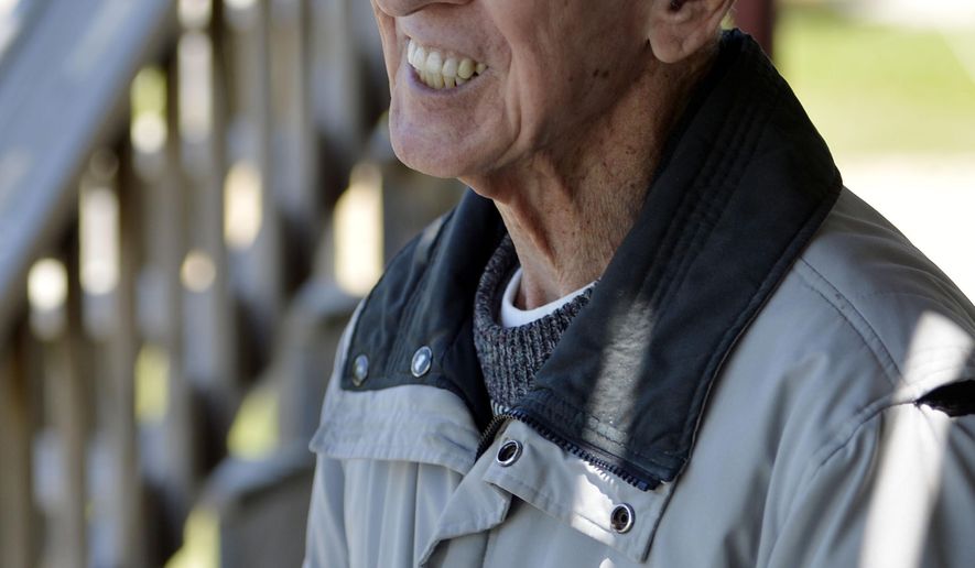ADVANCE FOR USE SATURDAY, JUNE 30 - In this Sunday, June 24, 2018 photo, John Ciesielski, 91, smiles as he greets family members after arriving to go skydiving at the Skydive Midwest Skydiving Center in Sylvania, Wis. Ciesielski always wanted to go skydiving, so his family got him a skydiving package for Father's Day. (Brian Passino/The Kenosha News via AP)