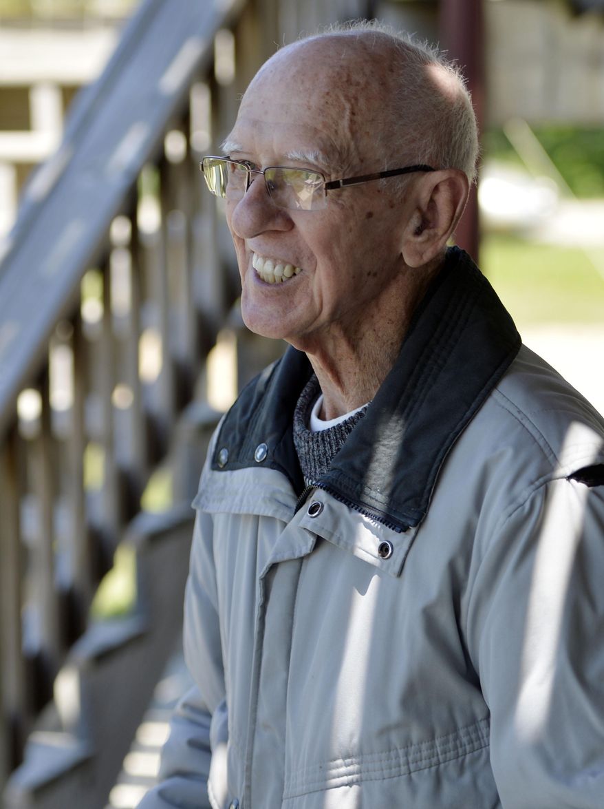 ADVANCE FOR USE SATURDAY, JUNE 30 - In this Sunday, June 24, 2018 photo, John Ciesielski, 91, smiles as he greets family members after arriving to go skydiving at the Skydive Midwest Skydiving Center in Sylvania, Wis. Ciesielski always wanted to go skydiving, so his family got him a skydiving package for Father's Day. (Brian Passino/The Kenosha News via AP)