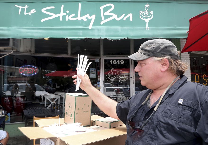 Buddy Sparrow with the Deerfield Beach Island Groups delivers paper straws to the Sticky Bun in Deerfield Beach. The restaurant never uses plastic straws or polystyrene take-out materials. They are participating in a city-wide "Strawless Summer" effort. Plastic awareness - and the urge to reduce the use of it - is growing in South Florida. (Mike Stocker/South Florida Sun-Sentinel via AP)/South Florida Sun-Sentinel via AP)