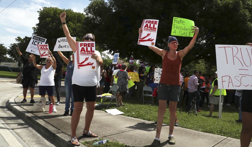 In this file photo, protesters rally against the practice of separating children from their parents and families being kept at the Broward Detention Center in Pompano Beach, Fla., Thursday, June 28, 2018. Carline Jean/South Florida Sun-Sentinel via AP) **FILE**