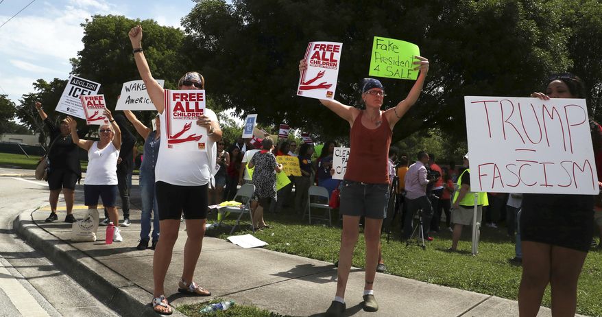 In this file photo, protesters rally against the practice of separating children from their parents and families being kept at the Broward Detention Center in Pompano Beach, Fla., Thursday, June 28, 2018. Carline Jean/South Florida Sun-Sentinel via AP) **FILE**