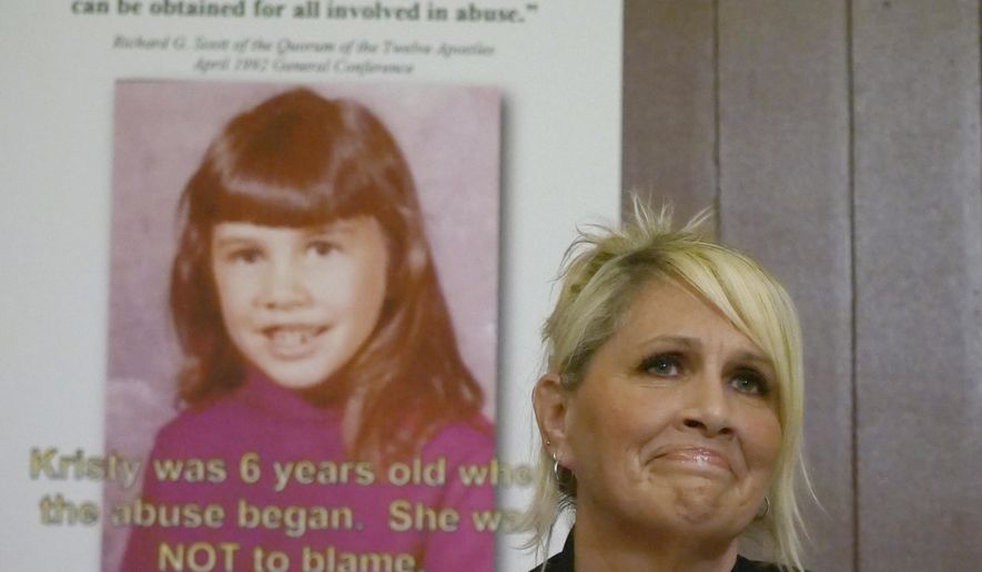 Kristy Johnson speaks during a news conference Thursday, June 28, 2018, in Salt lake City. Johnson, a California woman suing her father for sexual abuse that occurred during her childhood, says Mormon church leaders allowed the sexual assault to continue by failing to report it to police. Johnson said that her now-deceased mother told local church leaders about the abuse multiple times during the 1960-1970s. (AP Photo/Rick Bowmer)