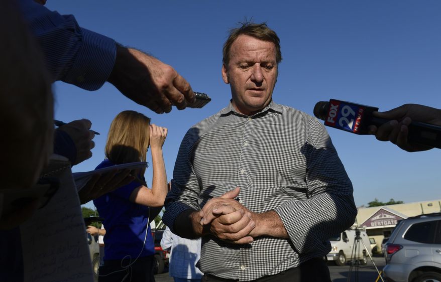 Annapolis Mayor Gavin Buckley speaks with reporters near the scene of a shooting in Annapolis, Md., Thursday, June 28, 2018. A gunman opened fire at a newspaper office in Annapolis on Thursday, killing several people and wounding several others before being taken into custody. (AP Photo/Susan Walsh)