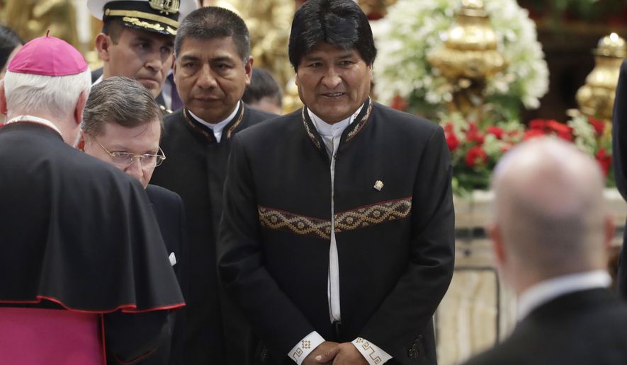 During his 12 years in office, Evo Morales has legalized the cultivation of coca leaves used to make cocaine, expelled U.S. counternarcotics agents from Bolivia and showered the coca-growing valley of Chapare with major public works projects, including an international airport. (AP Photo/Alessandra Tarantino)