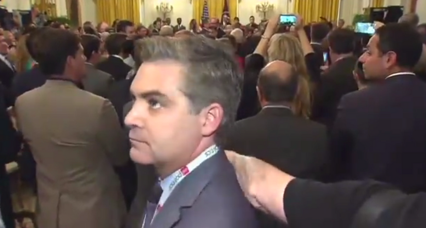 CNN&#39;s Jim Acosta turns around after shouting questions at President Trump during a tax reform anniversary event, June 29, 2018. (Image: Twitter, Politico video screenshot)