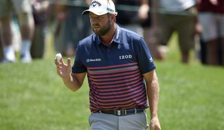 Marc Leishman, of Australia, acknowledges the gallery on the seventh green during the second round of the Quicken Loans National golf tournament, Friday, June 29, 2018, in Potomac, Md. (AP Photo/Nick Wass)