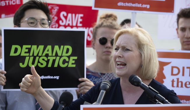 In this June 28, 2018 photo, Sen. Kirsten Gillibrand, D-N.Y., joins activists at the Supreme Court as President Donald Trump prepares to choose a replacement for Justice Anthony Kennedy, in Washington.  Several prominent Democrats who are mulling a bid for the White House in 2020 sought to bolster their progressive credentials this week by calling for major changes to immigration enforcement, with some pressing for the outright abolition of the federal government’s chief immigration enforcement agency. Sen. Kirsten Gillibrand of New York has said Immigration and Customs Enforcement, known as ICE, has “become a deportation force.”   (AP Photo/J. Scott Applewhite)