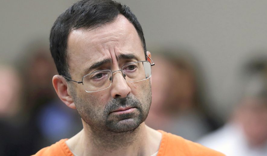 FILE - In this Nov. 22, 2017, file photo, Dr. Larry Nassar appears in court for a plea hearing in Lansing, Mich. Investigators in Texas on Friday, June 29, 2018, are expected to address allegations of criminal behavior by the disgraced former sports doctor at the famed gymnastics training center run by Bela and Martha Karolyi. The facility has since closed and Nassar has been imprisoned for life.(AP Photo/Paul Sancya, File)