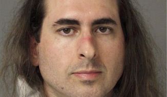 In this June 28 2018, file photo released by the Anne Arundel Police, Jarrod Warren Ramos poses for a photo, in Annapolis, Md. First-degree murder charges were filed Friday against Ramos who police said targeted Maryland&#39;s capital newspaper, shooting his way into the newsroom and killing four journalists and a staffer before officers swiftly arrested him. (Anne Arundel Police via AP)