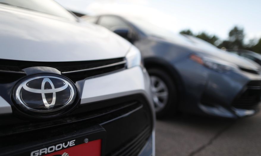 FILE - This Sunday, June 24, 2018 file photo shows the Toyota company logo on a car at a Toyota dealership in Englewood, Colo. Foreign automakers, American manufacturers and classic-car enthusiasts are coming out against President Donald Trump's plan to consider taxing imported cars, trucks and auto parts. Toyota Motor North America says the tariffs "would have a negative impact on all manufacturers, increasing the cost of imported vehicles as well as domestically produced vehicles that rely on imported parts." Friday, June 29, 2018 is the deadline for public comments on Trump's call for a Commerce investigation into whether auto imports pose enough of a threat to U.S. national security to justify tariffs. (AP Photo/David Zalubowski, File)