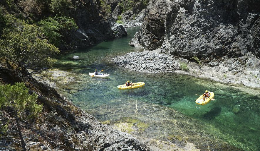 In a June 2018 photo, kayakers paddle through the Magic Canyon of the Chetco River. The National Wild and Scenic Rivers Act turns 50 this year. (Zach Collier/The Medford Mail Tribune via AP)