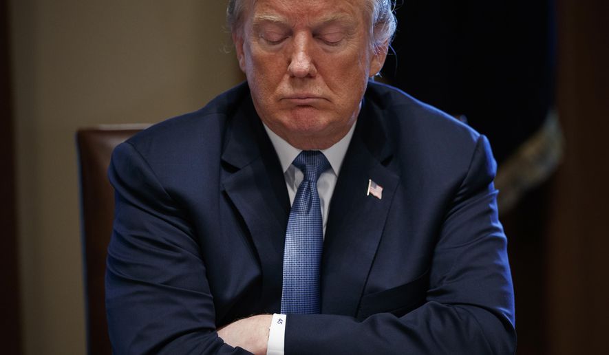 In this June 26, 2018 photo, President Donald Trump listens during a meeting with Republican lawmakers in the Cabinet Room of the White House in Washington. (AP Photo/Evan Vucci)