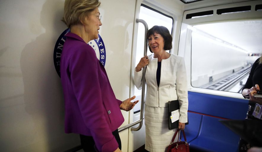 Sen. Elizabeth Warren, D-Mass., left, and Sen. Susan Collins, R-Maine, ride the Senate subway as they head to a vote on Capitol Hill, Wednesday, June 20, 2018 in Washington. (AP Photo/Jacquelyn Martin)