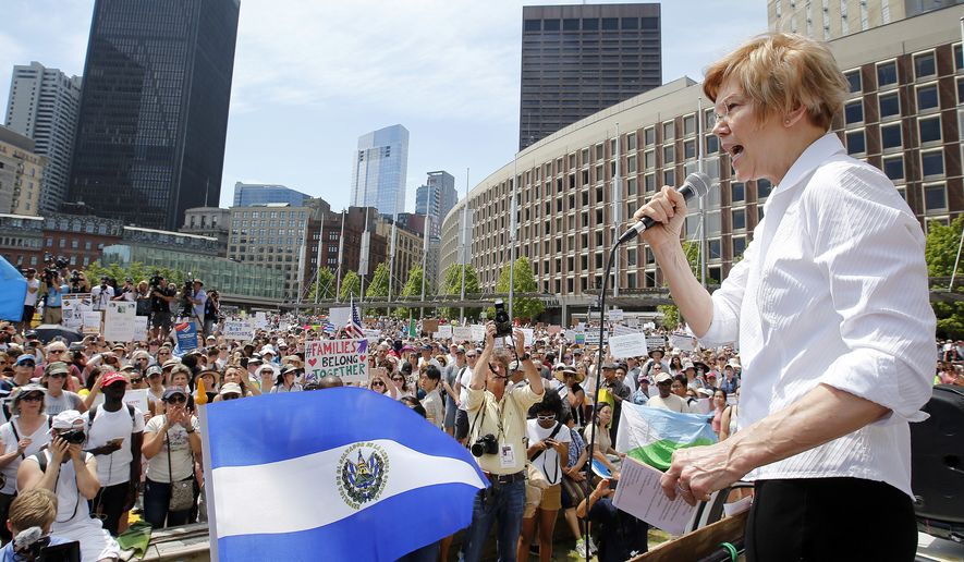 Sen. Elizabeth Warren, D-Mass., speaks at the Rally Against Separation Saturday, June 30, 2018, in Boston. (AP Photo/Winslow Townson)