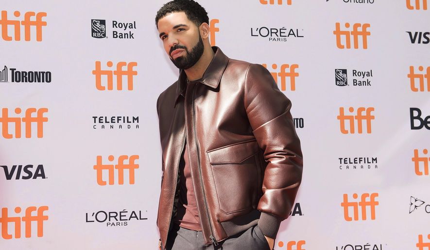 FILE - In this Sept. 9, 2017 file photo, Drake poses for photographs on the red carpet for the new documentary &amp;quot;The Carter Effect&amp;quot; during the 2017 Toronto International Film Festival in Toronto.  Drake’s “Scorpion” has set a new record for most one-day streams for an album on Apple Music. The streaming platform says the album, released Friday, June 30, 2018 logged more than 170 million streams worldwide, more than doubling Drake’s prior one-day record on Apple Music with last year’s “More Life.”  (Nathan Denette/The Canadian Press via AP, File)