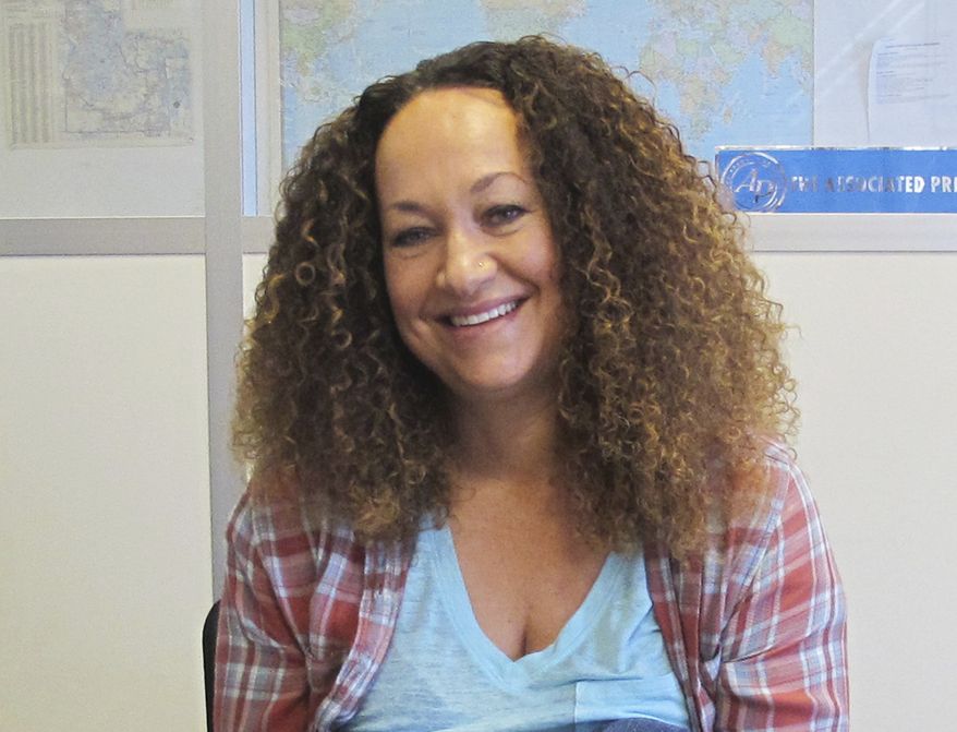 FILE - In this March 20, 2017, file photo, Nkechi Diallo, then known as Rachel Dolezal, poses at the bureau of The Associated Press in Spokane, Wash. The former NAACP leader in Washington state, whose life unraveled after she was exposed as a white woman pretending to be black, has pleaded not guilty to charges involving welfare fraud. Diallo entered the plea last week. (AP Photo/Nicholas K. Geranios, File)