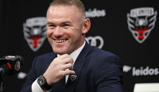 English soccer star Wayne Rooney, the all-time leading scorer for England&#39;s national team and Manchester United in the Premier League, smiles during a news conference announcing his signing with MLS team D.C. United, Monday, July 2, 2018, at the Newseum in Washington. (AP Photo/Jacquelyn Martin)