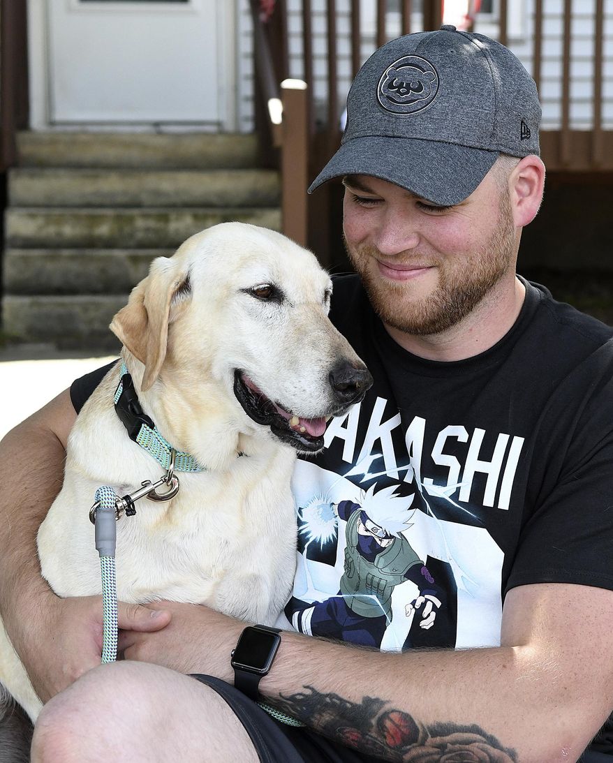 Seven years ago, Marine Nick Montez was unexpectedly ripped away from his bomb-sniffing dog Mally after returning from deployment in Afghanistan. Tuesday, June 26, 2018, he brought Mally home to Lewiston. (Pete Caster/Lewiston Tribune via AP)