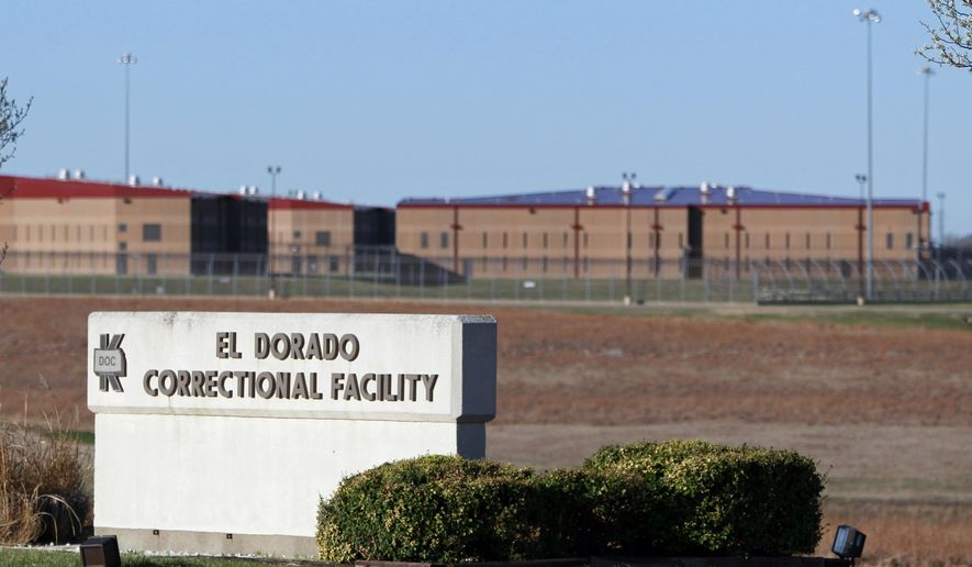 FILE - This March 23, 2011, file photo shows the El Dorado Correctional Facility near El Dorado, Kan. Officials say a group of inmates have surrendered after starting fires inside the prison during a disturbance Sunday, July 1, 2018. No injuries were reported. (AP Photo/Orlin Wagner, File)