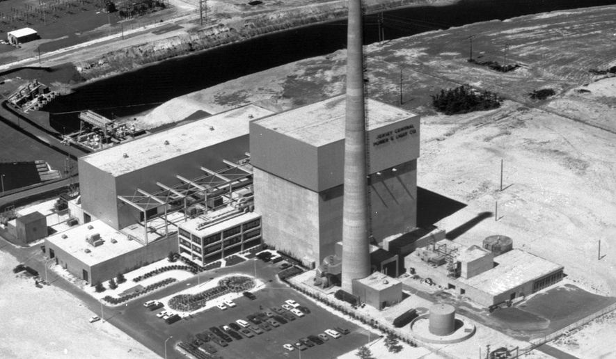 FILE - This July 12, 1972 file photo shows the Oyster Creek nuclear power plant in Lacey Township, N.J. Federal regulators say America’s oldest nuclear power plant will shut down Sept. 17, 2018, and plans to have its reactor fuel placed into dry storage within about six years. But the Oyster Creek plant, which opened in 1969, will remain in Lacey Township, New Jersey, until nearly the end of this century. (AP Photo, File)